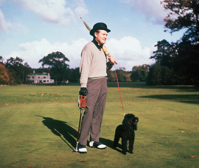 Actor And Comedian Bob Hope Plays Golf With His Dog